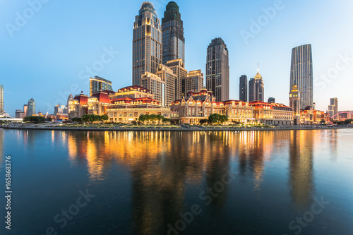 Tianjin city waterfront downtown skyline with Haihe river China.