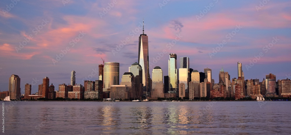 The Financial District and skyline of downtown Manhattan at sunset. 