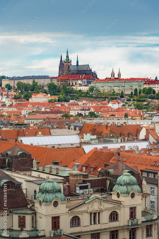 Obraz premium Prague view from above in daytime with cloudy blue sky, Vertical