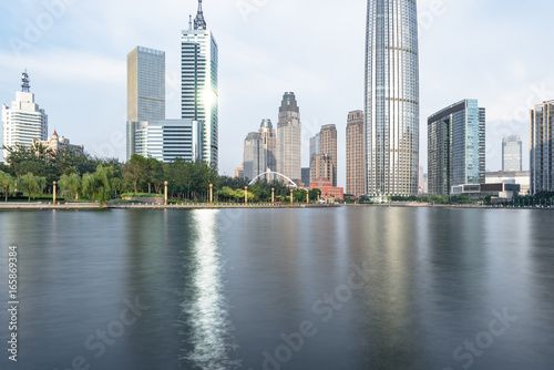 Tianjin city waterfront downtown skyline with Haihe river China.