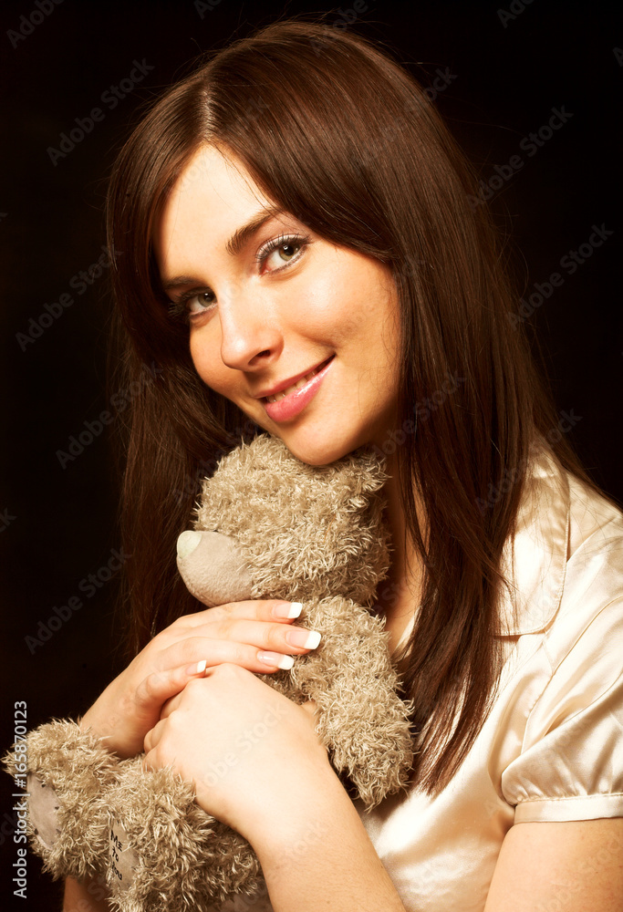 woman holding a teddy bear woman holding a teddy bear