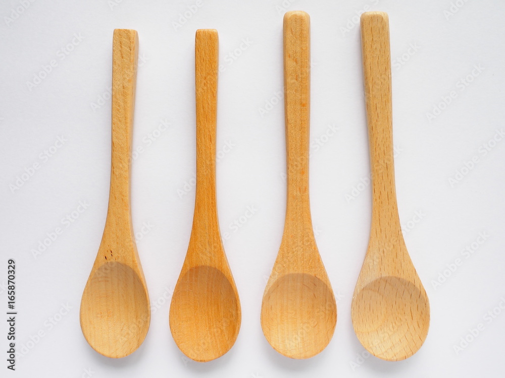 set of four beech wood tea spoons on white background set of four beech wood tea spoons on white background