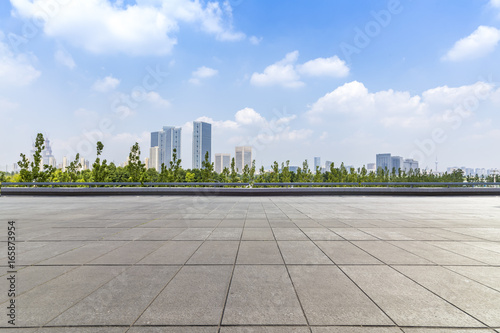 Panoramic skyline and buildings with empty concrete square floor © MyCreative