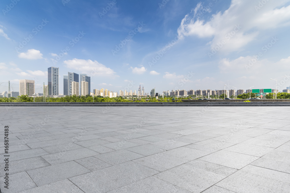 Panoramic skyline and buildings with empty concrete square floor Panoramic skyline and buildings with empty concrete square floor