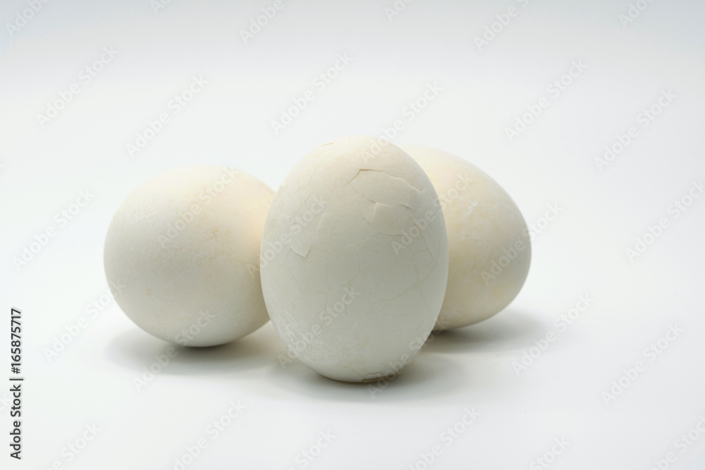 Salted egg which boiled have cracked shell put on white background Salted egg which boiled have cracked shell put on white background