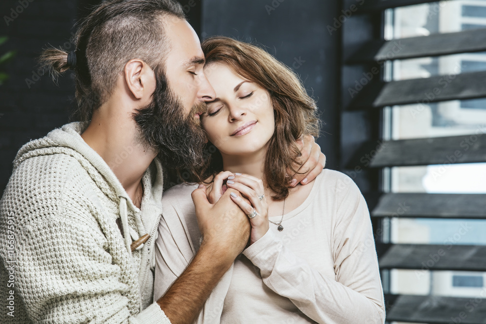 Heterosexual couples young beautiful man and woman on bed in bedroom at home