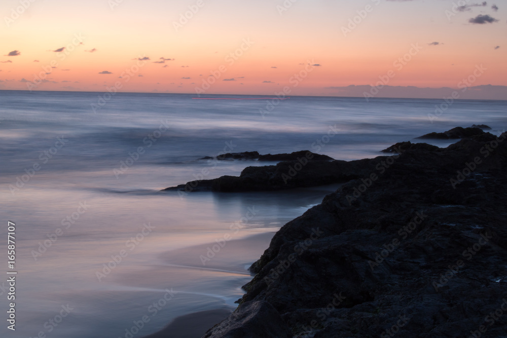 sunrise beach water ocean rocks