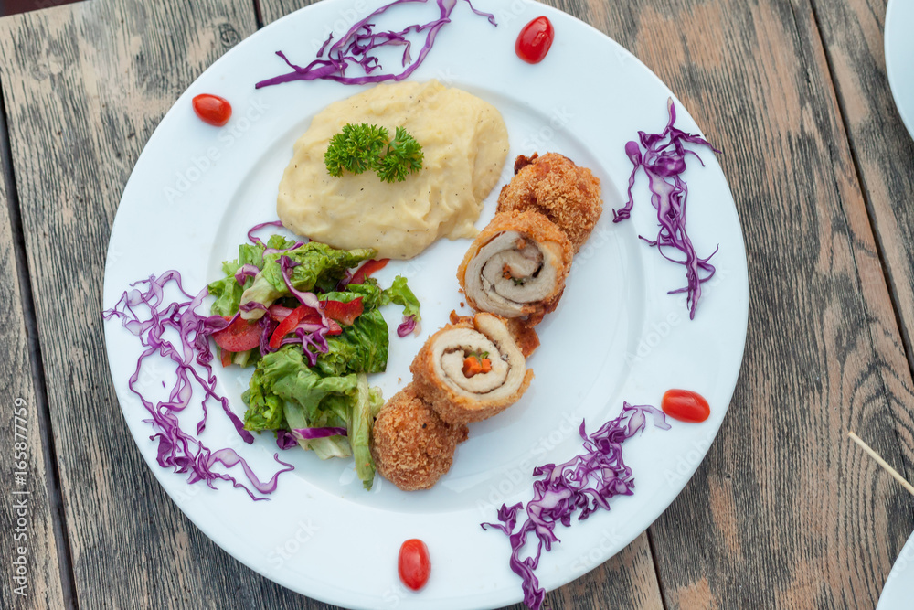 Baked chicken rolls with vegetable salad and mashed potato Baked chicken rolls with vegetable salad and mashed potato
