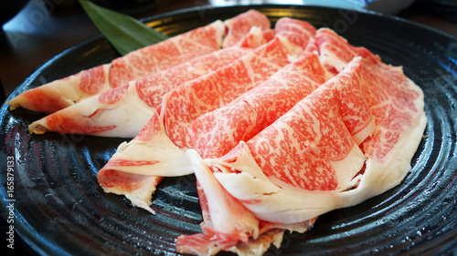 Premium raw shabu shabu japanese beef sliced on plate 