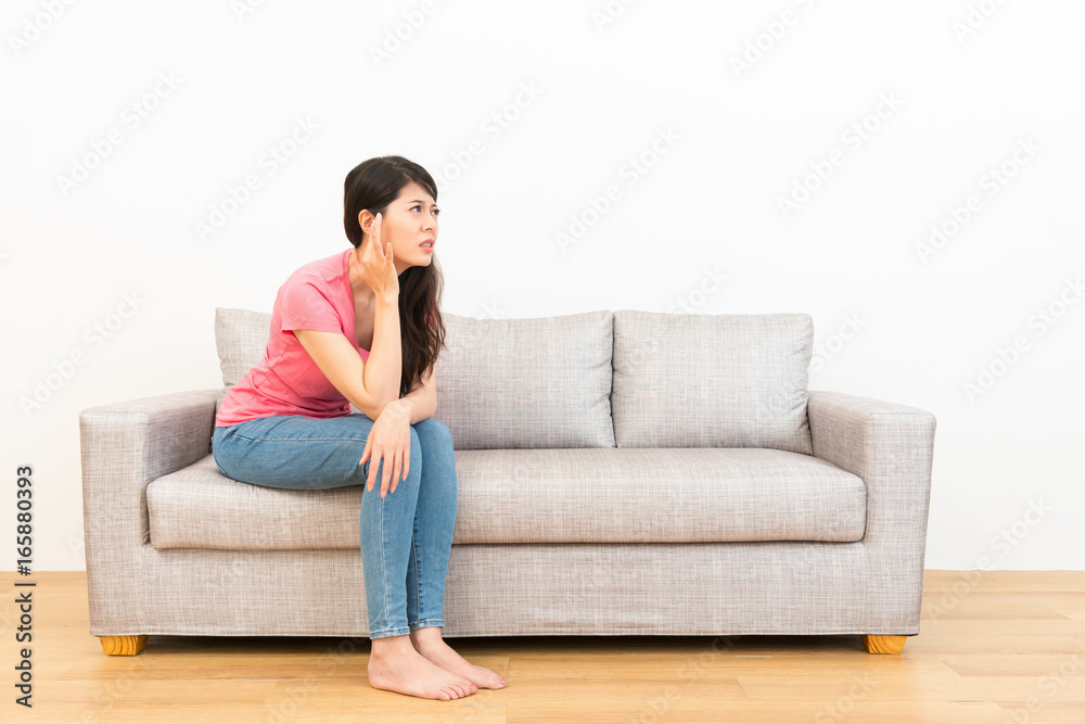 young woman crushed ear painful position young woman crushed ear painful position