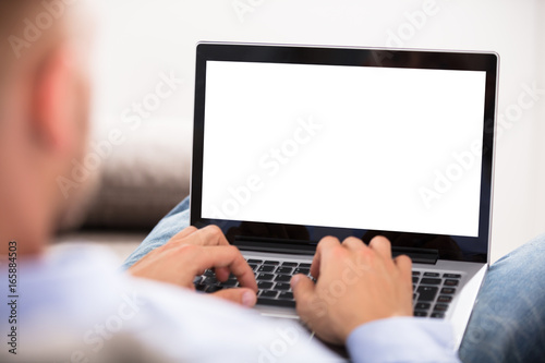 Close-up Of A Man Holding Laptop