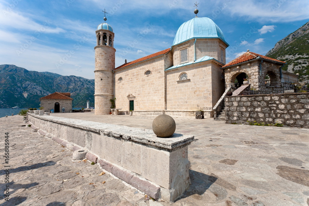 Old medieval church on the island at Perast, Kotor Bay, Montenegro. Famous touristic destination.