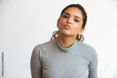 Photography Funny attractive Indian girl with puckered lips