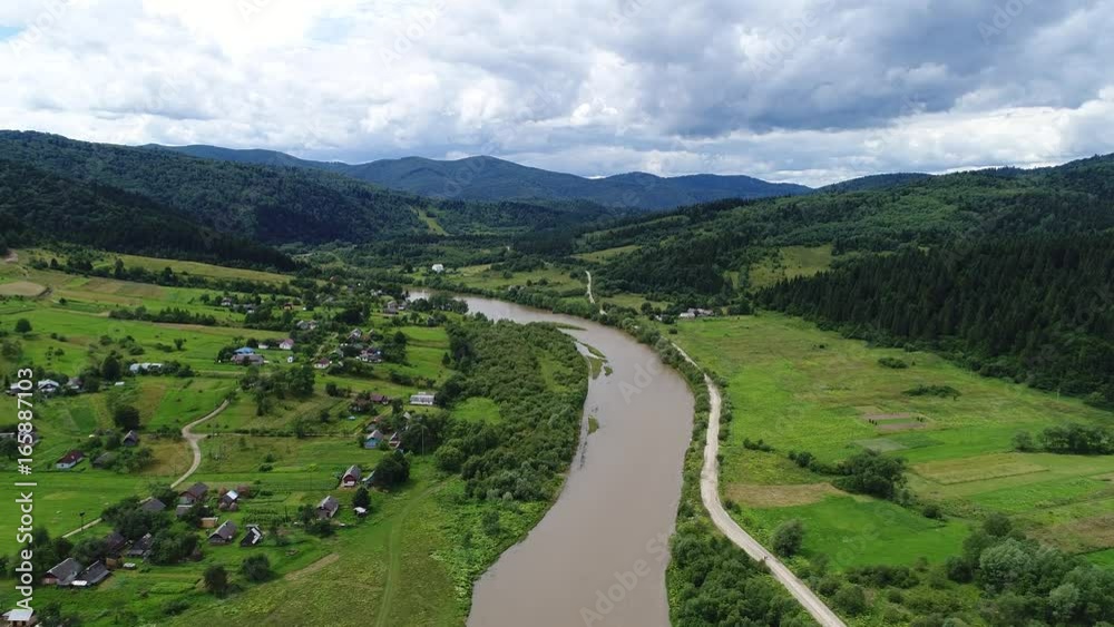aerial view agriculture field and mountains. summer day. Summer day landscape. Flying over the beautiful rural landscape. Aerial camera shot. aerial view agriculture field and mountains. summer day. Summer day landscape. Flying over the beautiful rural landscape. Aerial camera shot.