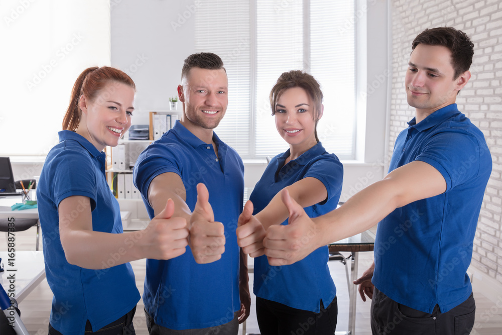 © Andrey Popov - Happy Janitors Showing Thumb Up Sign © Andrey Popov - Happy Janitors Showing Thumb Up Sign