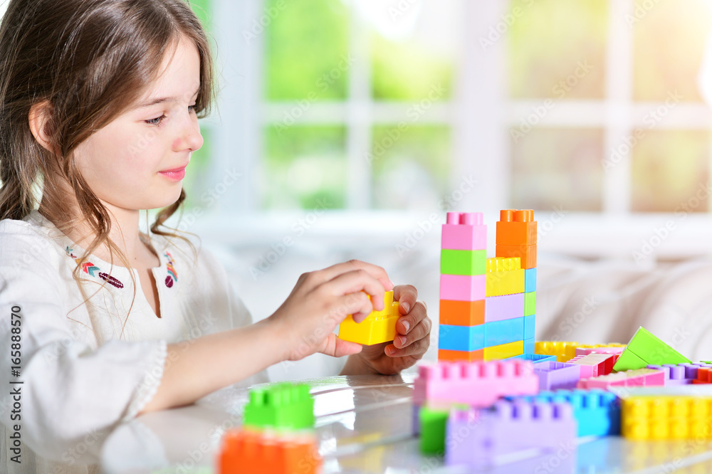 Cute girl playing with blocks