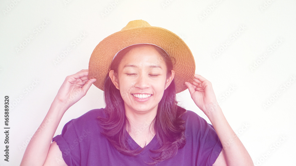 Asian girl wearing straw hat summer fun. Relax and happy expression Asian girl wearing straw hat summer fun. Relax and happy expression
