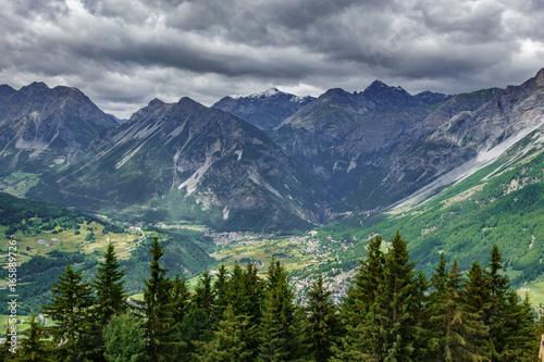 Bormio city and Dolomites top view, stormy clouds