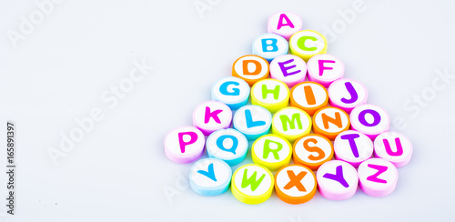  alphabet printed on the shape eraser for learning purposes. Copy space for text and logo.
