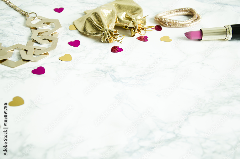 The women's accessories lie on the marble table The women's accessories lie on the marble table