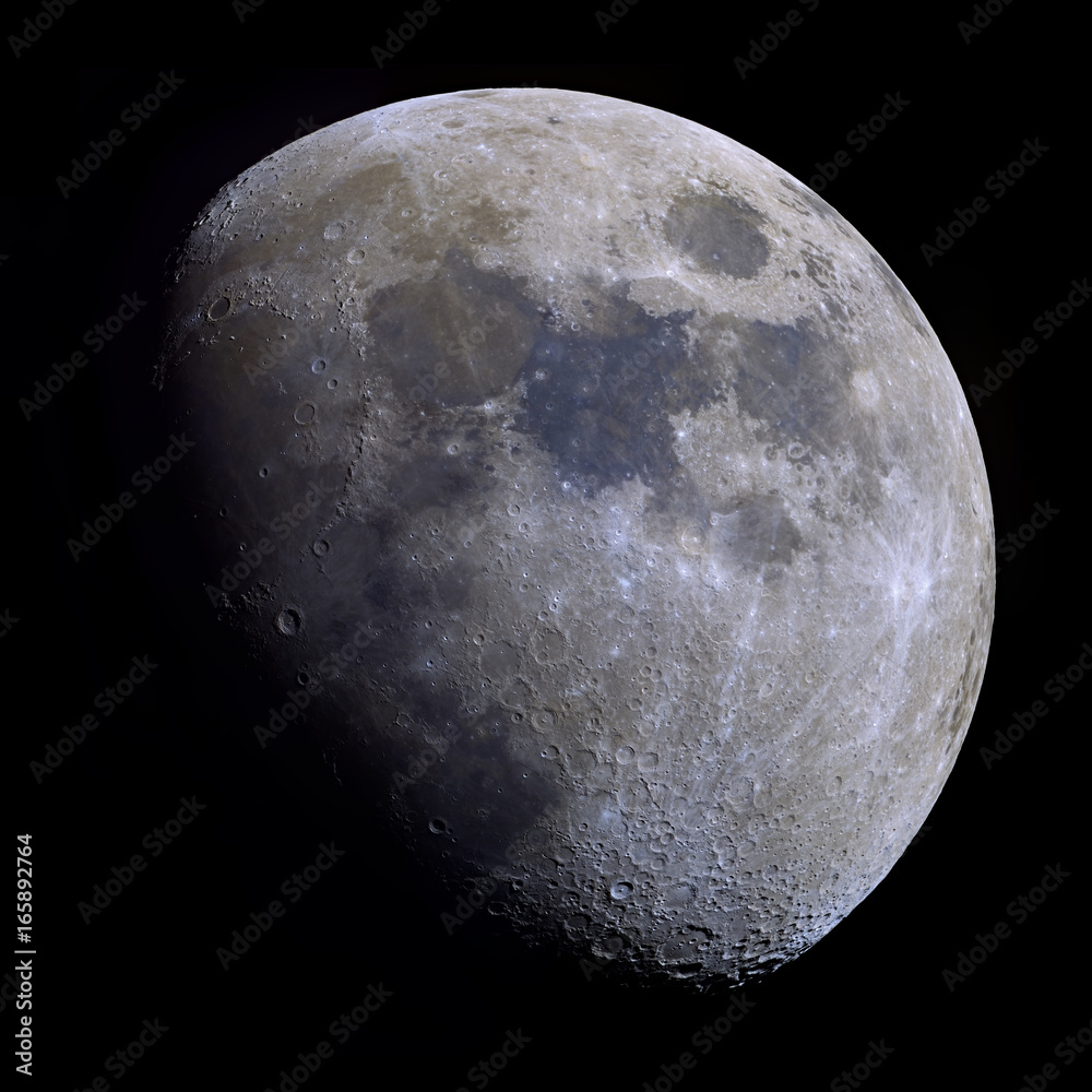 Obraz premium Very high detail Gibbous Moon shot at 2.700mm focal length. 30 panel mosaic with increased saturation to highlight the mineral composition of the moon's surface.