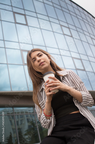 Beautiful girl with a glass of coffee 