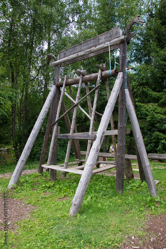 Old wooden swing of standing type.