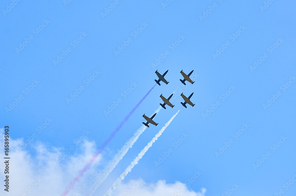 Sport planes aerobatic team vapour trails in blue sky. Plane white vapour trails tracks background. Plane aerobatic maneuver stunt. Stunt planes aerobatic team vapor trails. Sport planes aerobatic team vapour trails in blue sky. Plane white vapour trails tracks background. Plane aerobatic maneuver stunt. Stunt planes aerobatic team vapor trails.