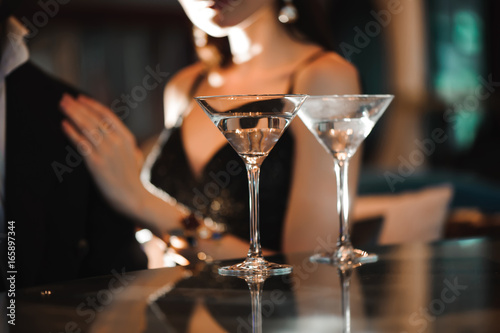 Two glasses of martini coctail in a bar