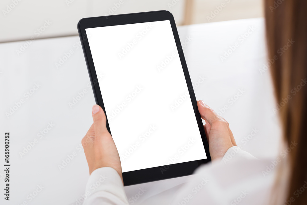 Human Hand Holding Digital Tablet