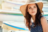 Portrait of beautiful fashionable woman on a colorful summer background