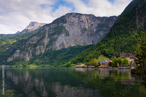 Scenic picture-postcard view of traditional old wooden houses in famous Hallstatt mountain village at Hallstattersee lake in the Austrian Alps in summer  region of Salzkammergut  Austria