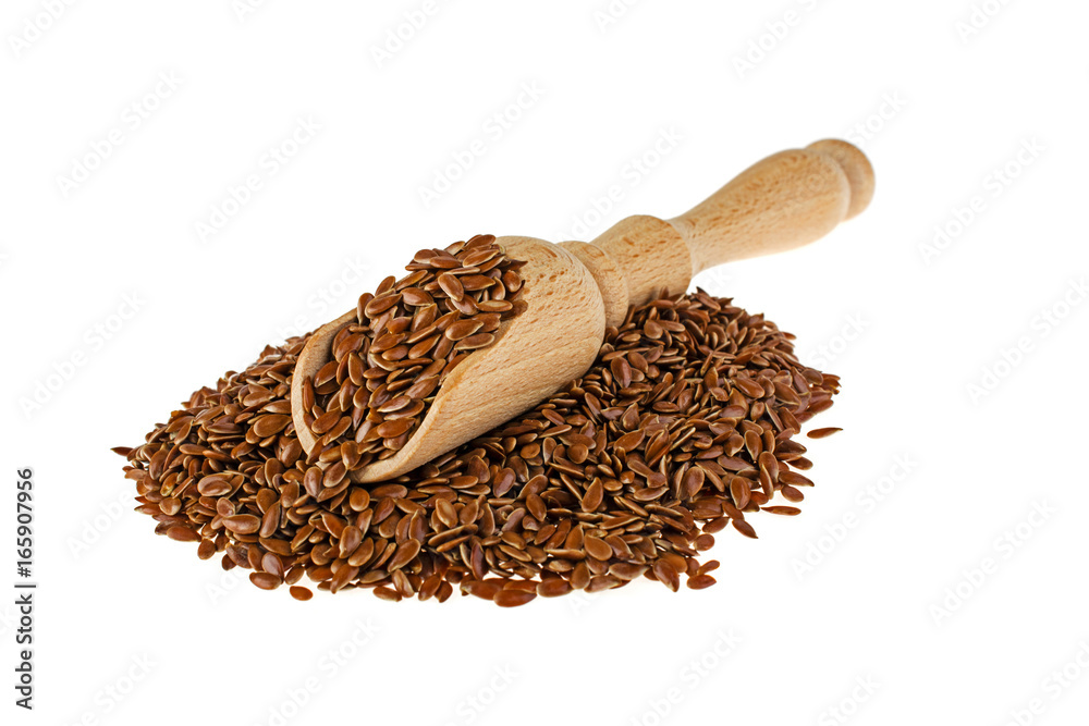 Flax seeds and spoon on white background Flax seeds and spoon on white background