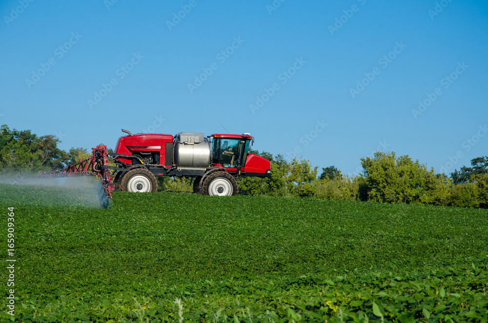Fertilizer machine on the field Fertilizer machine on the field