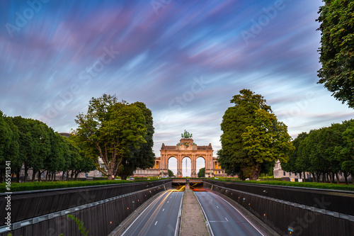 Dramatic view of the Triumphal Arch and Belliard Tunnel in Park Cinquantenaire in Brussels during sunset