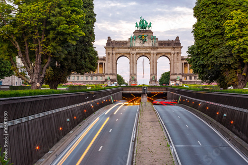 Dramatic view of the Triumphal Arch and Belliard Tunnel in Park Cinquantenaire in Brussels during sunset