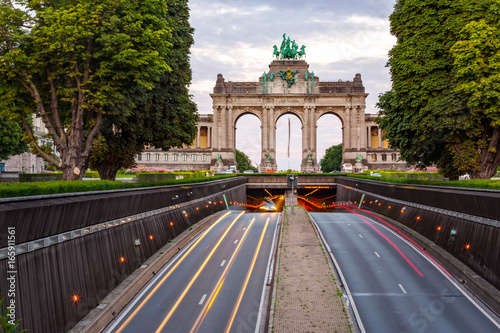 Dramatic view of the Triumphal Arch and Belliard Tunnel in Park Cinquantenaire in Brussels during sunset