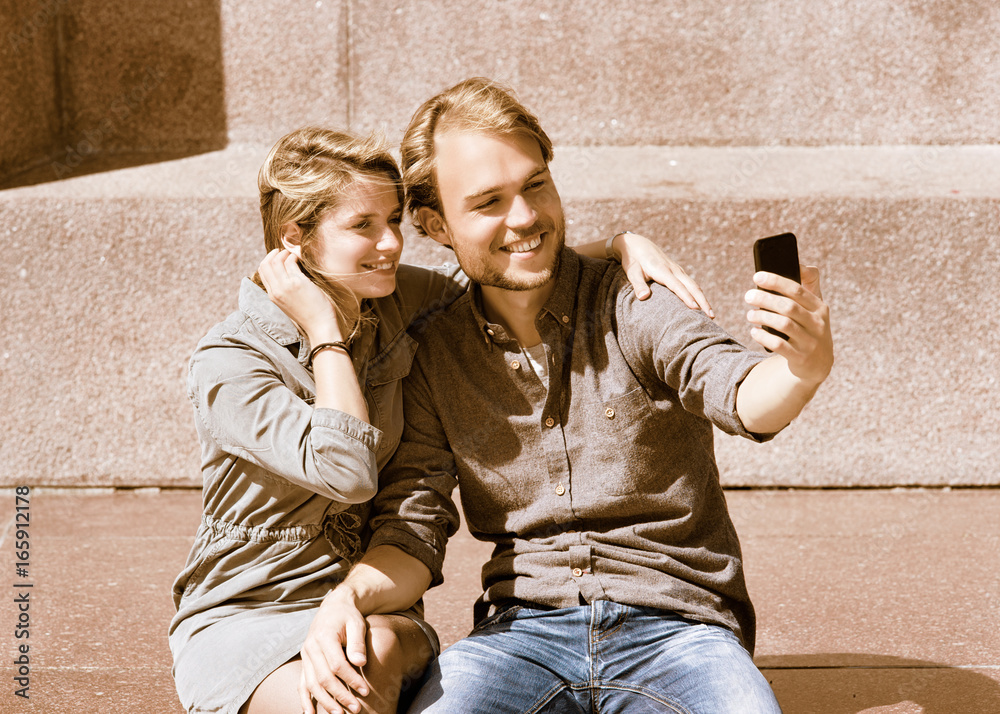 Young man making selfie with his girlfriend while dating Young man making selfie with his girlfriend while dating