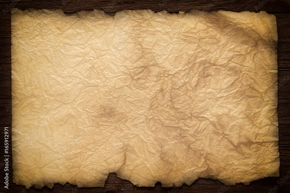 Old paper on the wood background, ancient scroll Stock Photo | Adobe Stock