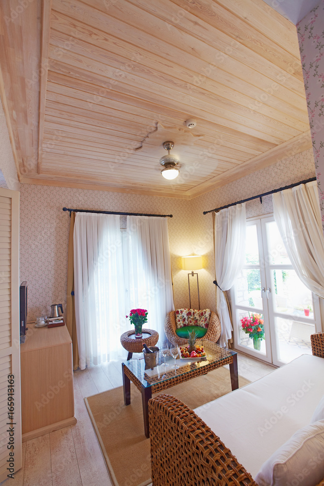 Wooden concept warm cozy hotel room decorated for guests