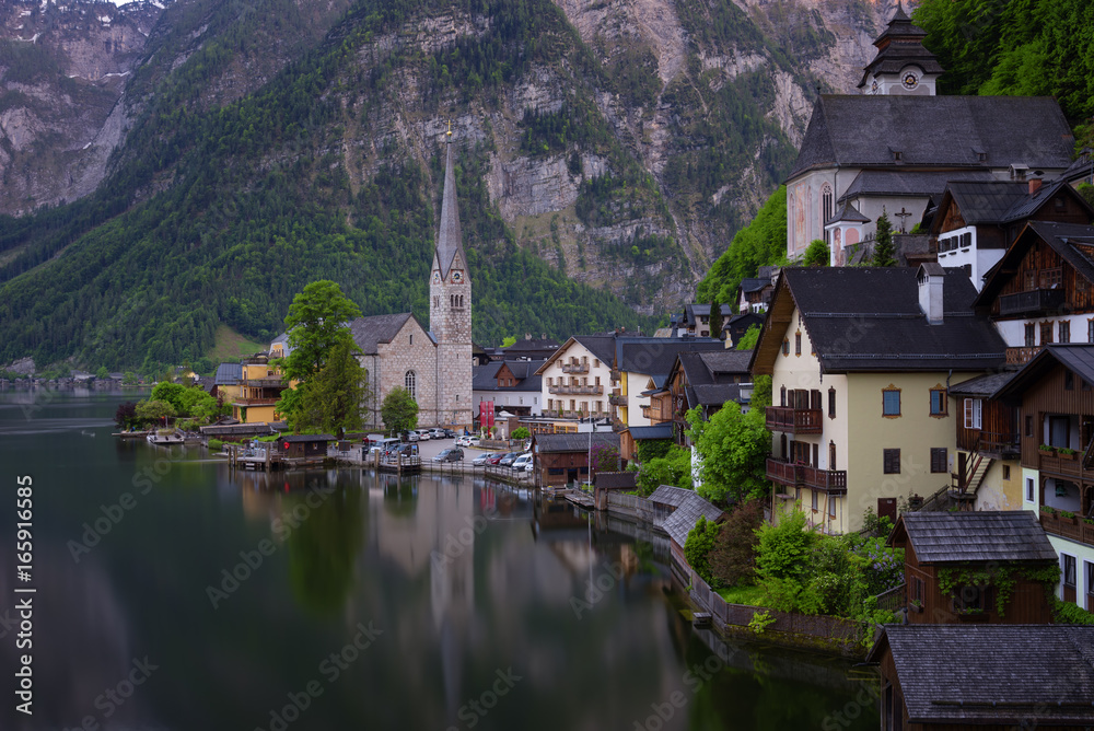 Fototapeta premium Classic postcard view of famous Hallstatt lakeside town in the Alps on a beautiful sunny day in the summer, Salzkammergut region, Austria
