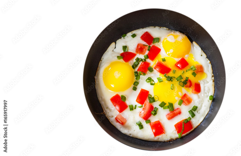 fried eggs with vegetables in a frying pan. top view. isolated on white fried eggs with vegetables in a frying pan. top view. isolated on white
