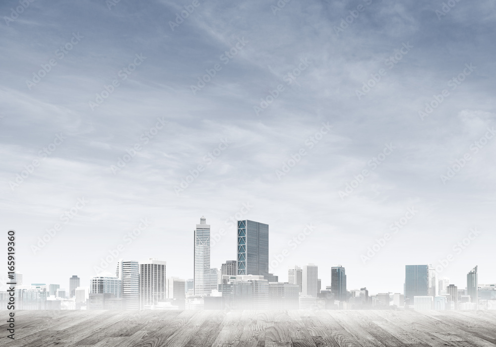 Obraz premium Modern urban buildings skyscrapers blue cloudy sky background and wooden textured platform