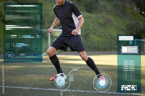 soccer player playing with ball on football field