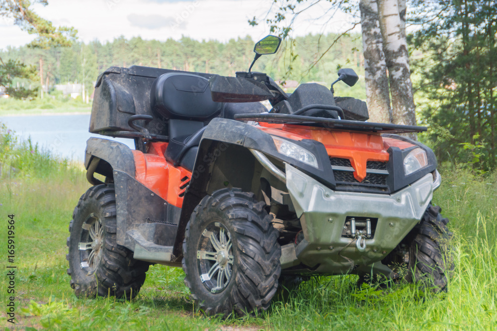 off-road motorcycle is on the road in a wooded area. off-road motorcycle is on the road in a wooded area.