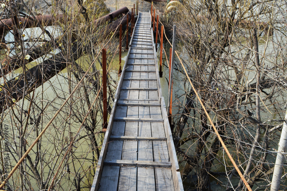 Fototapeta premium Wooden bridge across the river