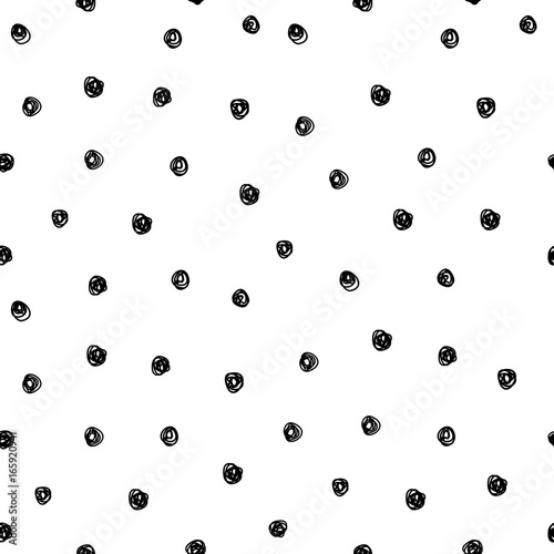 Vector illustration of hand drawn seamless pattern. Black dots isolated on white background.