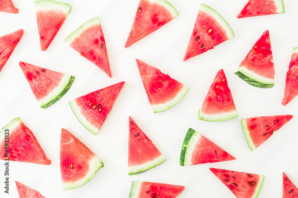 Pattern of sliced red watermelon on white background. Flat lay, top view Pattern of sliced red watermelon on white background. Flat lay, top view