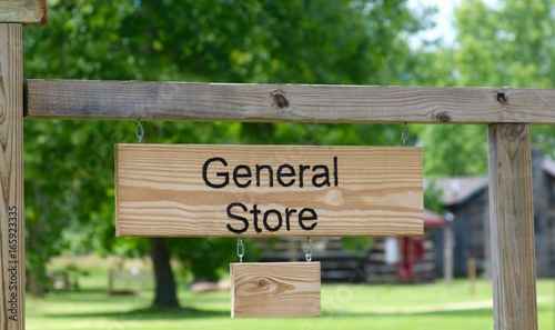 Billede på lærred The general store sign on a close up view.