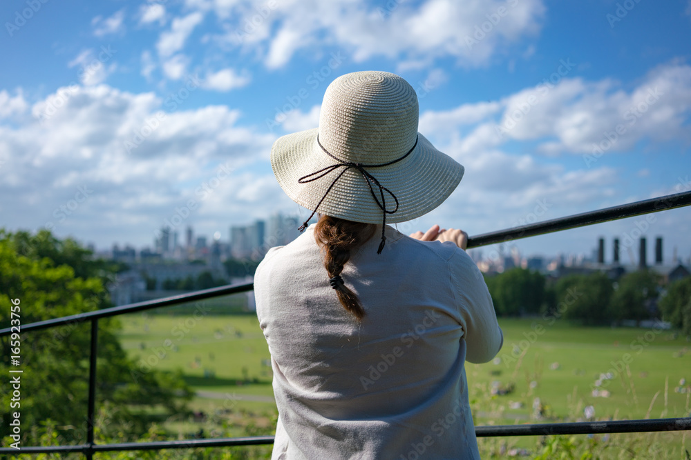 woman with hat in greenwich